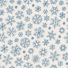 Seamless embroidery snowflakes background.