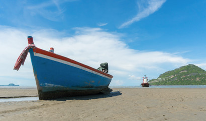 Fototapeta na wymiar Blue Fishing Boat on Sam Roi Yod Beach Prachuap Khiri Khan Thailand Left
