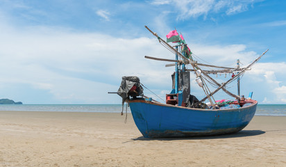 Naklejka na ściany i meble Blue Fishing Boat on Sam Roi Yod Beach Prachuap Khiri Khan Thailand Right