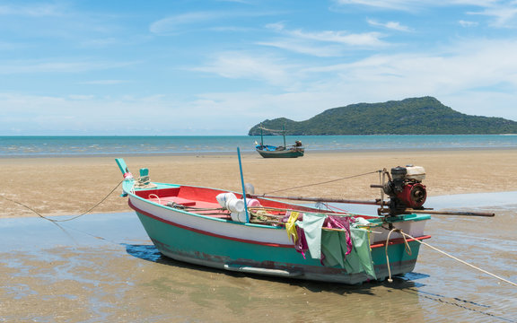 Green Fishing Boat and Blue Sky on Sam Roi Yod Beach Prachuap Khiri Khan Thailand
