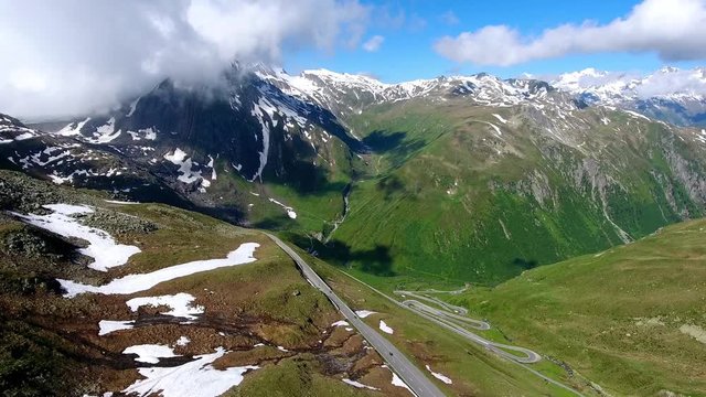 Aerial shot of Nufenenpass 
Early summer with unmelted patches of snow