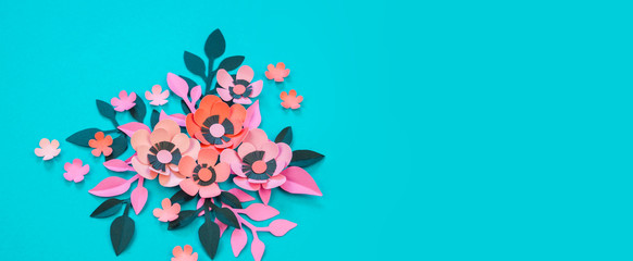 Flower and leaves of paper turquoise background