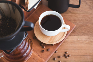 Top view image of drip coffee set on vintage wooden background
