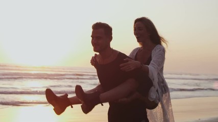 Young man giving piggyback ride to his girlfriend