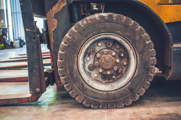 The front wheels of the forklift.