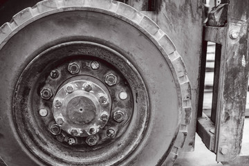 The front wheels of the forklift.