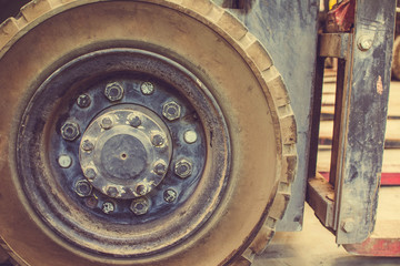 The front wheels of the forklift.