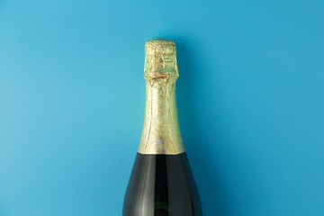 Champagne bottle on blue background, Celebration concept.