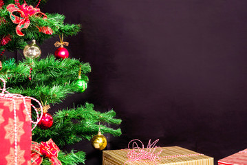 christmas tree with christmas gifts on black background