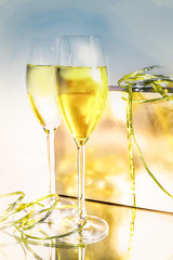 Two glasses of wine and a box on white background