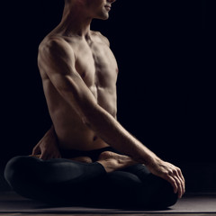 Yogi relaxed man with muscular body training