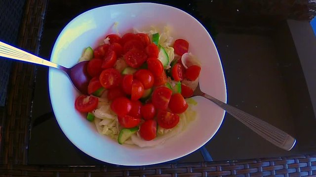 Chinese Lettuce and Cherry Tomatoes Salad, garnished and mixed in the bowl.