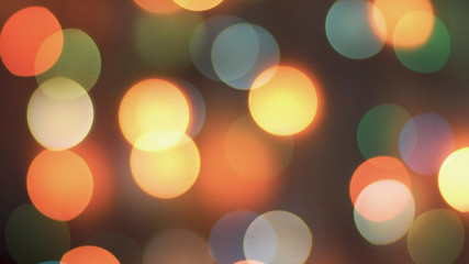 Colorful sparkling bokeh and flashing new year lights in soft focus. Abstract sparkling