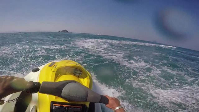 Video in first person going fast on a jet ski in Thailand Phuket on a sunny day. Vacation living life. 60FPS. Clip 17