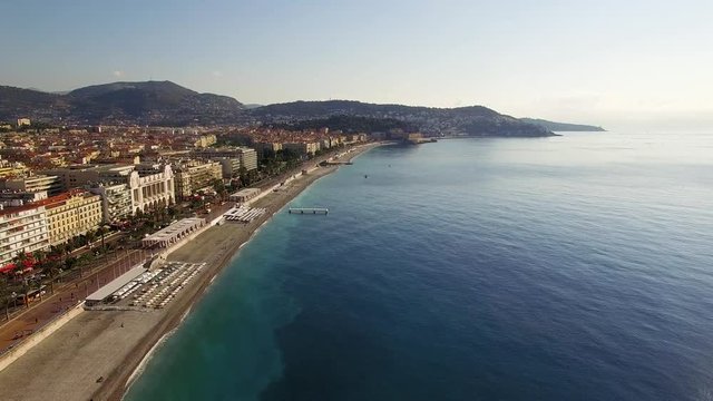 Clear day aerial in Nice France of a drone flying along the Promenade towards the east