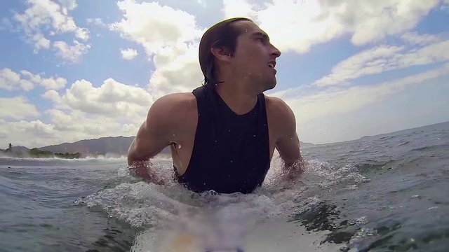 POV: Surfer Paddles into Wave