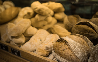Focus on shelves with bread in a supermarket