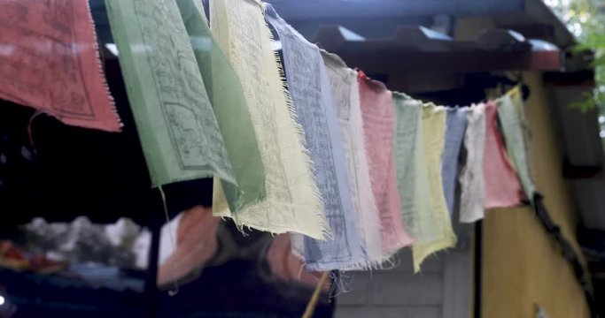 A prayer flag is a colourful rectangular cloth, often found strung along mountain ridges and peaks high in the Himalayas. They are used to bless the surrounding countryside and for other purposes.