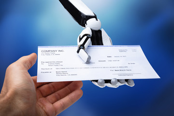 Robotic Hand Giving Cheque To Person