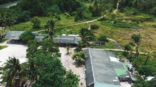A small village on Thailand. Camera fly away.