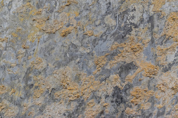 background of rough cement wall. concrete wall with white abrasion and small holes.