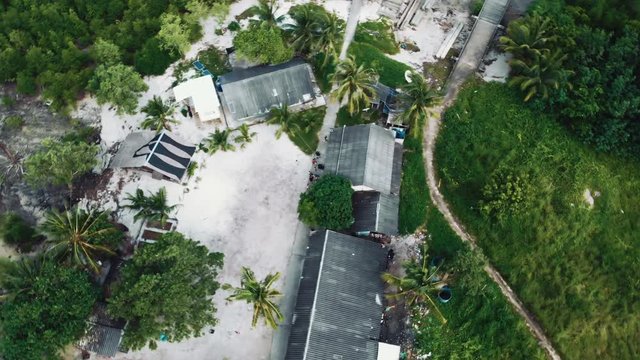 A small village on Thailand. Top view.  The camera flies in a circle.
