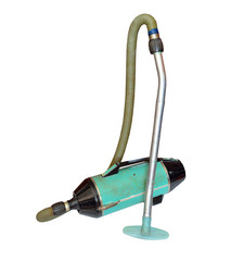 Vintage vacuum cleaner,  sweeper or hoover. Isolated on white ba