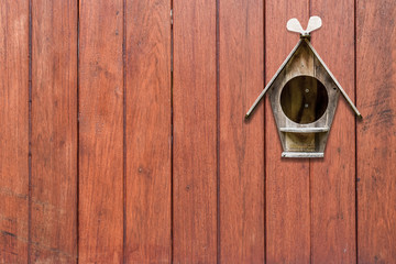 wood mailbox on dark brown wooden plank background. letters and messages, postman vintage view