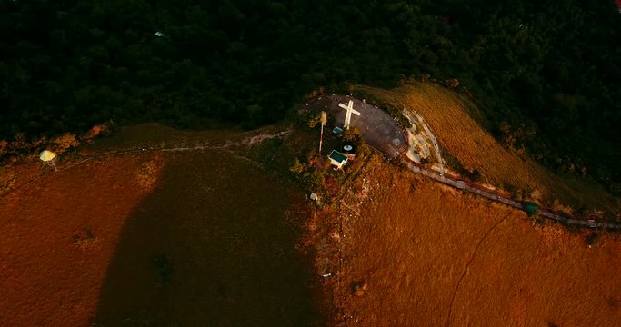 Aerial - drone flying over the hill with a cross. Mt Tapyas in Coron, Palawan, Philippines.