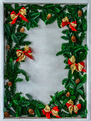 Christmas border with copy space. New year symbol. red bow and christmas tree branches