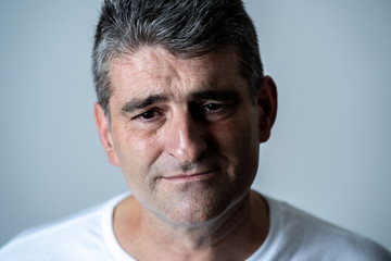 Sad and desperate mature handsome man feeling depressed in Facial expressions and depression