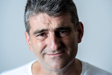 Obraz premium Sad and desperate mature handsome man feeling depressed in Facial expressions and depression