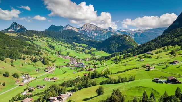 Beautiful drone hyperlapse taken on a sunny day in the summer. Some clouds are passing by. The camera moves to the left.