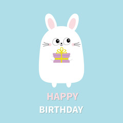Fototapeta premium Happy Birthday. White bunny rabbit holding gift box. Funny head face. Big eyes. Cute kawaii cartoon character. Baby greeting card template. Blue background. Flat design.