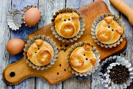 Pig bread buns, funny baking idea shaped cute piggy faces, symbolic food for new year 2019