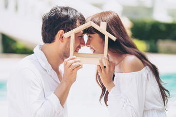 Young couple planning to buy a house and have happy living.
