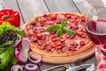 Homemade cheese pizza with salami