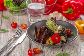 Grilled seafood salad on wooden table