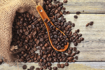 Roasted coffee beans on a wooden floor
