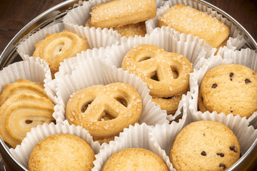 A closeup photo of Danish butter cookies in the traditional tin box