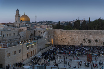 Numerous believers are in the evening near the Western Wall in the old city of Jerusalem for a...