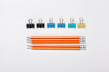 Pencils arranged in The Row  and Paper Clips top view