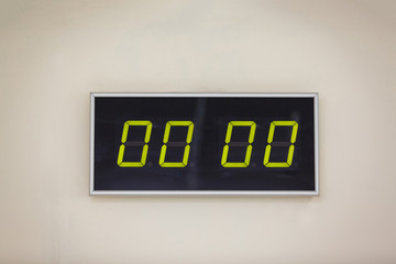 Black digital clock on a white background showing time 00 00