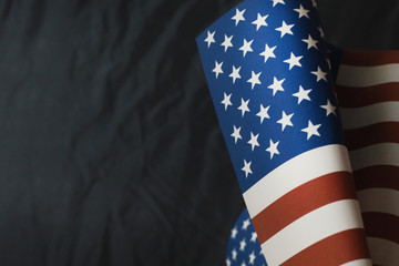 Obraz premium The Veterans Day concept united states of America flag on black background..