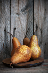 Brown pears on rustic wood © Svetlana Lukienko