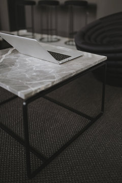 A laptop on a marble table