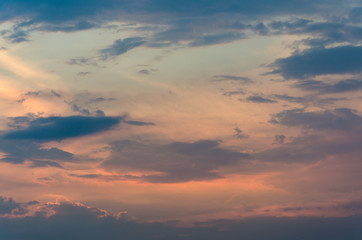 Yellow evening sunset in the sky with clouds