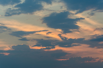 Yellow evening sunset in the sky with clouds