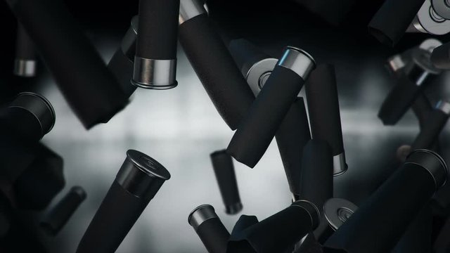 Animation falling of bullets different calibers on dark and blurred background. Animation of seamless loop.