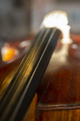 violin in vintage style on wood background close up